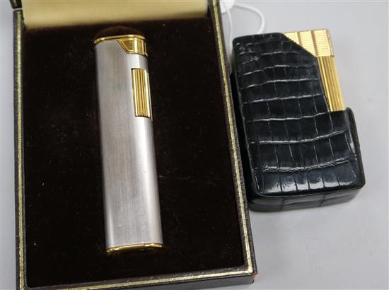 A cased Dunhill lighter and a Dupont lighter.